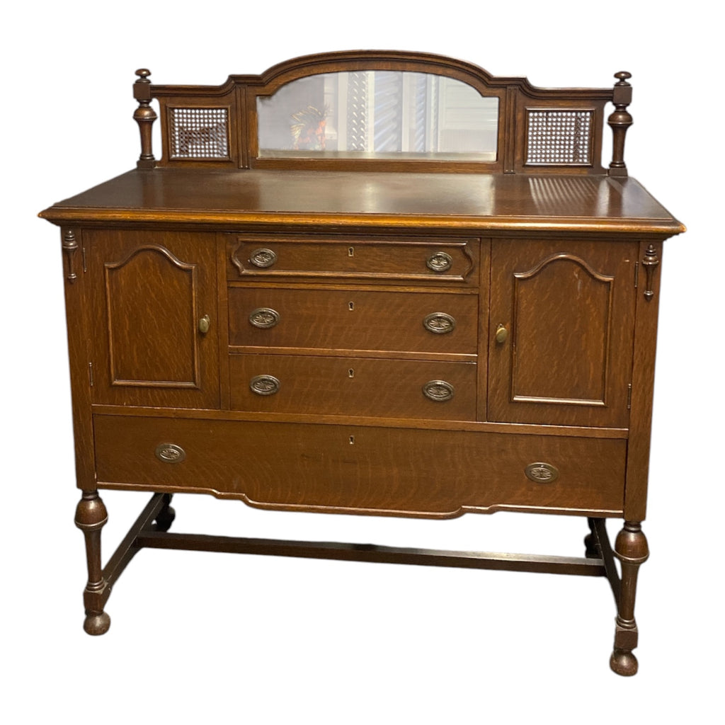 1920s Quartersawn Oak Jacobean Revival Sideboard with Beveled Mirror & Cane Pane