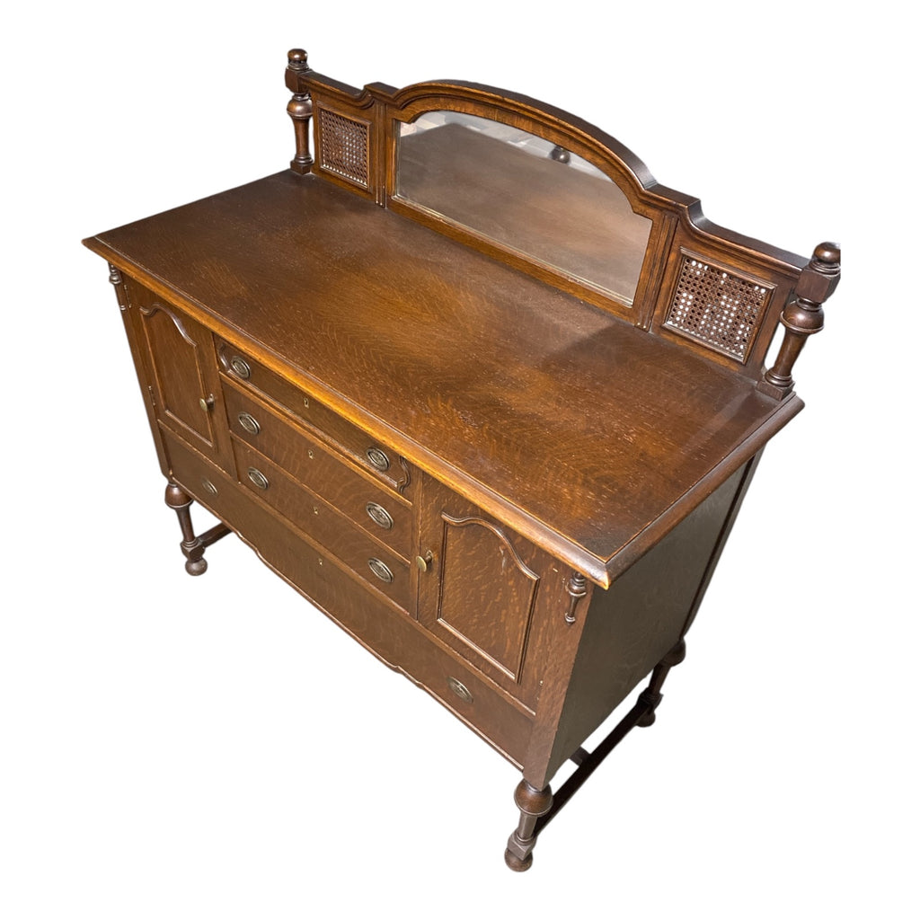 1920s Quartersawn Oak Jacobean Revival Sideboard with Beveled Mirror & Cane Pane